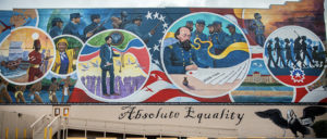 Mural of Gordon Granger signing the Special orders with African American soldiers looking on